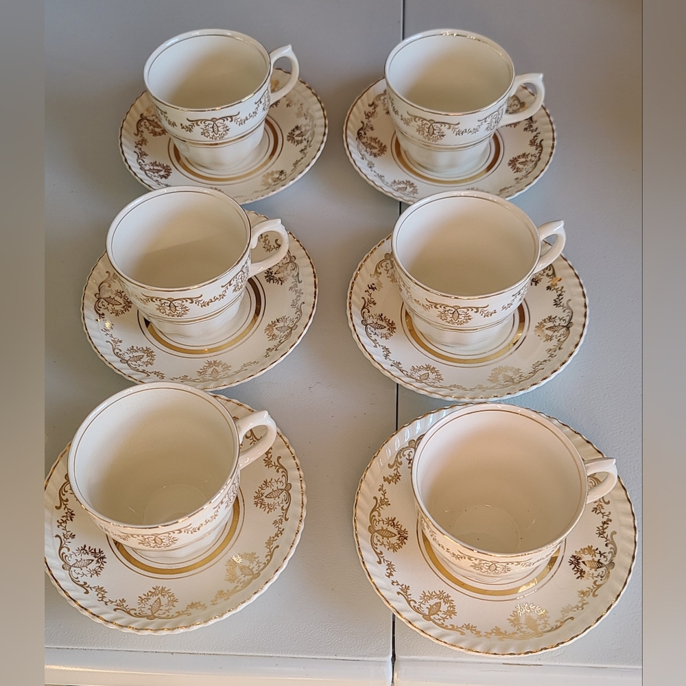 Vintage teacups with saucers and small plates